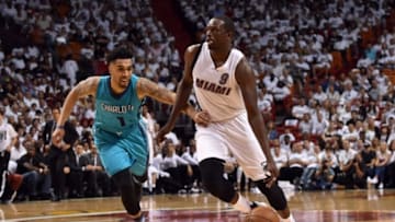 Apr 17, 2016; Miami, FL, USA; Miami Heat forward Luol Deng (9) dribbles the ball as Charlotte Hornets guard Courtney Lee (1) defends during the second half in game one of the first round of the NBA Playoffs at American Airlines Arena. The Heat won 123-91. Mandatory Credit: Steve Mitchell-USA TODAY Sports