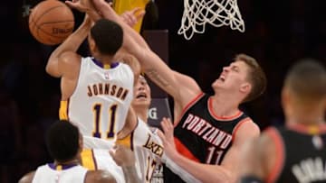 Jan 11, 2015; Los Angeles, CA, USA; Portland Trail Blazers center Meyers Leonard (11) battles Los Angeles Lakers forward Wesley Johnson (11) and guard Jeremy Lin (17) for a rebound in the second half of the game at Staples Center. Trailblazers won 104-96. Mandatory Credit: Jayne Kamin-Oncea-USA TODAY Sports
