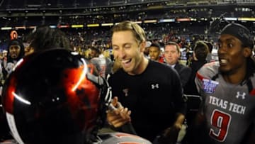 Dec 30, 2013; San Diego, CA, USA; Texas Tech Red Raiders head coach Kliff Kingsbury celebrates with players after a win against the Arizona State Sun Devils in the Holiday Bowl at Qualcomm Stadium. Texas Tech won 37-23. Mandatory Credit: Christopher Hanewinckel-USA TODAY Sports