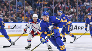 Mar 31, 2023; Buffalo, New York, USA; Buffalo Sabres right wing Kyle Okposo (21) advances the puck against the New York Rangers in the second period at KeyBank Center. Mandatory Credit: Mark Konezny-USA TODAY Sports