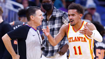 ORLANDO, FLORIDA - DECEMBER 15: Trae Young #11 of the Atlanta Hawks argues a foul call with referee Pat Fraher #26 against the Orlando Magic during the first half at Amway Center on December 15, 2021 in Orlando, Florida. NOTE TO USER: User expressly acknowledges and agrees that, by downloading and or using this photograph, User is consenting to the terms and conditions of the Getty Images License Agreement. (Photo by Michael Reaves/Getty Images)