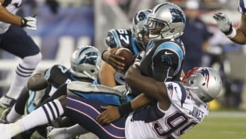 Aug 22, 2014; Foxborough, MA, USA; New England Patriots defensive end Chandler Jones (95) sacks Carolina Panthers quarterback Cam Newton (1) during the first quarter at Gillette Stadium. Mandatory Credit: Stew Milne-USA TODAY Sports