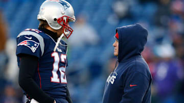 FOXBORO, MA - JANUARY 10: Tom Brady #12 and head coach Bill Belichick of the New England Patriots talk before the 2014 AFC Divisional Playoffs game against the Baltimore Ravens at Gillette Stadium on January 10, 2015 in Foxboro, Massachusetts. (Photo by Jim Rogash/Getty Images)