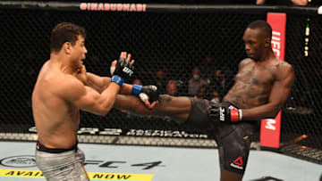 ABU DHABI, UNITED ARAB EMIRATES - SEPTEMBER 27: (R-L) Israel Adesanya of Nigeria kicks Paulo Costa of Brazil in their middleweight championship bout during UFC 253 inside Flash Forum on UFC Fight Island on September 27, 2020 in Abu Dhabi, United Arab Emirates. (Photo by Josh Hedges/Zuffa LLC via Getty Images)