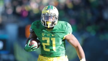 Nov 27, 2015; Eugene, OR, USA; Oregon Ducks running back Royce Freeman (21) runs the ball against the Oregon State Beavers at Autzen Stadium. Mandatory Credit: Scott Olmos-USA TODAY Sports