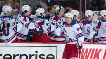 DETROIT, MI - MARCH 07: Pavel Buchnevich #89 of the New York Rangers pounds gloves with teammates on the bench following his first period goal during an NHL game against the Detroit Red Wings at Little Caesars Arena on March 7, 2019 in Detroit, Michigan. (Photo by Dave Reginek/NHLI via Getty Images)