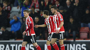 SOUTHAMPTON, ENGLAND - JANUARY 13: Shane Long (R) of Southampton celebrates scoring his team's first goal with his team mates Steven Davis (L) and Cedric Soares (C) during the Barclays Premier League match between Southampton and Watford at St. Mary's Stadium on January 13, 2016 in Southampton, England. (Photo by Ian Walton/Getty Images)