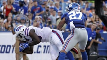 Aug 20, 2016; Orchard Park, NY, USA; Buffalo Bills running back LeSean McCoy (25) catches a pass for a touchdown as New York Giants safety Darian Thompson (27) defends during the first half at New Era Field. Mandatory Credit: Kevin Hoffman-USA TODAY Sports