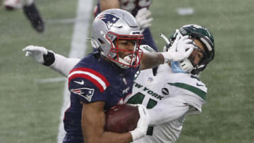 Jan 3, 2021; Foxborough, Massachusetts, USA; New England Patriots wide receiver Jakobi Meyers (16) stiff arms New York Jets safety Matthias Farley (41) during the second half at Gillette Stadium. Mandatory Credit: Winslow Townson-USA TODAY Sports