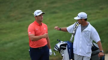 DUBLIN, OHIO - JULY 19: Jon Rahm of Spain celebrates with his caddie Adam Hayes after chipping in for birdie on the 16th hole during the final round of The Memorial Tournament on July 19, 2020 at Muirfield Village Golf Club in Dublin, Ohio. (Photo by Sam Greenwood/Getty Images)