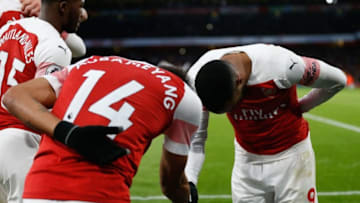 Arsenal's Gabonese striker Pierre-Emerick Aubameyang (L) shakes hands with Arsenal's French striker Alexandre Lacazette (R) after Aubameyang scored their second goal from the penalty spot during the English Premier League football match between Arsenal and Manchester United at the Emirates Stadium in London on March 10, 2019. (Photo by Ian KINGTON / IKIMAGES / AFP) / RESTRICTED TO EDITORIAL USE. No use with unauthorized audio, video, data, fixture lists, club/league logos or 'live' services. Online in-match use limited to 45 images, no video emulation. No use in betting, games or single club/league/player publications. (Photo credit should read IAN KINGTON/AFP/Getty Images)