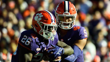 Clemson quarterback D.J. Uiagalelei (5) hands the ball to running back Phil Mafah (26) during the third quarter at Memorial Stadium Saturday, Nov 13, 2021.Jm Clemson 113221 029