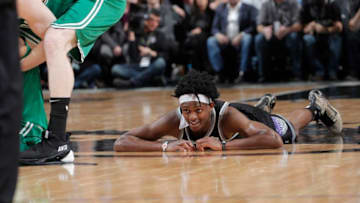 SACRAMENTO, CA - MARCH 6: De'Aaron Fox #5 of the Sacramento Kings lays on the floor during the game against the Boston Celtics on March 6, 2019 at Golden 1 Center in Sacramento, California. NOTE TO USER: User expressly acknowledges and agrees that, by downloading and or using this photograph, User is consenting to the terms and conditions of the Getty Images Agreement. Mandatory Copyright Notice: Copyright 2019 NBAE (Photo by Rocky Widner/NBAE via Getty Images)