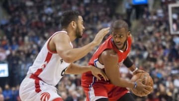 Jan 24, 2016; Toronto, Ontario, CAN; Los Angeles Clippers guard Chris Paul (3) shields the ball from Toronto Raptors guard Cory Joseph (6) in the first quarter at Air Canada Centre. The Raptors beat the Clippers 112 - 94. Mandatory Credit: Peter Llewellyn-USA TODAY Sports