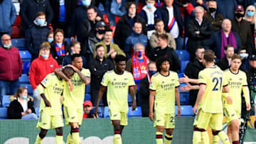 LONDON, ENGLAND - MAY 19: Nicolas Pepe of Arsenal celebrates with team mate Gabriel Magalhaes after scoring his team's first goal during the Premier League match between Crystal Palace and Arsenal at Selhurst Park on May 19, 2021 in London, England. A limited number of fans will be allowed into Premier League stadiums as Coronavirus restrictions begin to ease in the UK. (Photo by Facundo Arrizabalaga - Pool/Getty Images)