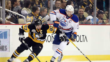 Nov 8, 2016; Pittsburgh, PA, USA; Edmonton Oilers center Connor McDavid (97) controls the puck against Pittsburgh Penguins center Sidney Crosby (87) during the first period at the PPG Paints Arena. Mandatory Credit: Charles LeClaire-USA TODAY Sports
