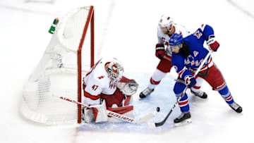 TORONTO, ONTARIO - AUGUST 04: James Reimer #47 of the Carolina Hurricanes makes a save against Mika Zibanejad #93 of the New York Rangers during the first period in Game Three of the Eastern Conference Qualification Round prior to the 2020 NHL Stanley Cup Playoffs at Scotiabank Arena on August 04, 2020 in Toronto, Ontario, Canada. (Photo by Andre Ringuette/Freestyle Photo/Getty Images)