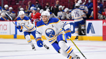 MONTREAL, QC - FEBRUARY 13: Kyle Okposo #21 of the Buffalo Sabres skates against the Montreal Canadiens during the third period at Centre Bell on February 13, 2022 in Montreal, Canada. The Buffalo Sabres defeated the Montreal Canadiens 5-3. (Photo by Minas Panagiotakis/Getty Images)