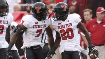 Sep 19, 2015; Fayetteville, AR, USA; Texas Tech Red Raiders defensive back Tevin Madison (20) celebrates after an interception in the first quarter with defensive back Jah