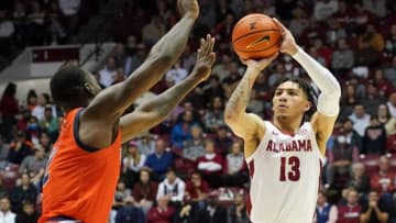 Auburn football stars from different eras celebrated the Tigers' huge hoops win over Alabama. Mandatory Credit: Tuscaloosa News
