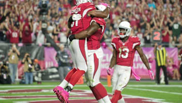 Oct 17, 2016; Glendale, AZ, USA; Arizona Cardinals running back David Johnson (31) celebrates with offensive tackle D.J. Humphries (74) after scoring a touchdown in the first half against the New York Jets at University of Phoenix Stadium. Mandatory Credit: Matt Kartozian-USA TODAY Sports