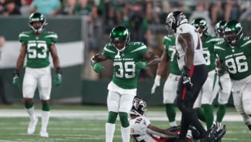 Aug 22, 2022; East Rutherford, New Jersey, USA; New York Jets safety Will Parks (39) celebrates after tackling Atlanta Falcons wide receiver Cameron Batson (16) during the first half at MetLife Stadium. Mandatory Credit: Vincent Carchietta-USA TODAY Sports