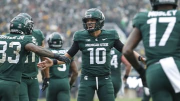 Oct 30, 2021; East Lansing, Michigan, USA; Michigan State Spartans quarterback Payton Thorne (10) celebrates with teammates during the fourth quarter against the Michigan Wolverines at Spartan Stadium. Mandatory Credit: Raj Mehta-USA TODAY Sports