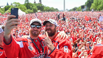 WASHINGTON, DC - JUNE 12: Washington Capitals defenseman Brooks Orpik (44) takes a selfie with Alex Ovechkin (8) and thousands of fans during the Parade for the Stanley Cup Champion Washington Capitals. (Photo by Jonathan Newton/The Washington Post via Getty Images)