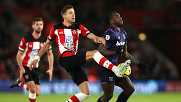 SOUTHAMPTON, ENGLAND - DECEMBER 14: Michail Antonio of West Ham United battles for possession with Jan Bednarek of Southampton during the Premier League match between Southampton FC and West Ham United at St Mary's Stadium on December 14, 2019 in Southampton, United Kingdom. (Photo by Naomi Baker/Getty Images)