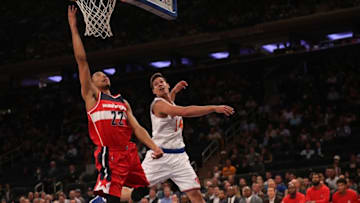 Oct 10, 2016; New York, NY, USA; Washington Wizards forward Otto Porter Jr. (22) shoots the ball as New York Knicks center Willy Hernangomez (14) defends during the first quarter at Madison Square Garden. Mandatory Credit: Anthony Gruppuso-USA TODAY Sports