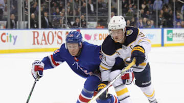 Jack Eichel #9 of the Buffalo Sabres skates against Kaapo Kakko #24 of the New York Rangers (Photo by Bruce Bennett/Getty Images)