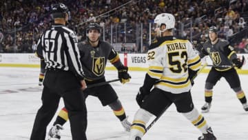 LAS VEGAS, NV - OCTOBER 15: David Perron #57 of the Vegas Golden Knights and Sean Kuraly #52 of the Boston Bruins listen to instructions from an official prior to a face-off during the game at T-Mobile Arena on October 15, 2017 in Las Vegas, Nevada. (Photo by Todd Lussier/NHLI via Getty Images)