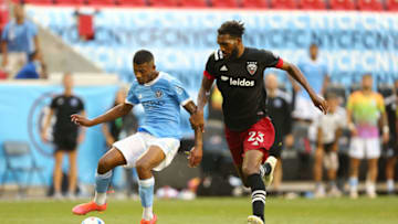 Jun 27, 2021; Harrison, New Jersey, USA; New York City FC forward Thiago Andrade (8) plays the ball against D.C. United defender Donovan Pines (23) before scoring his goal during the second half of a game between D.C. United and NYCFC at Red Bull Arena. Mandatory Credit: Danny Wild-USA TODAY Sports
