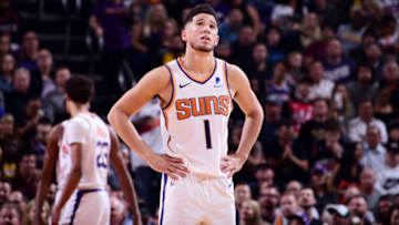PHOENIX, AZ - NOVEMBER 12: Devin Booker #1 of the Phoenix Suns looks on during the game against the Los Angeles Lakers on November 12, 2019 at Talking Stick Resort Arena in Phoenix, Arizona. NOTE TO USER: User expressly acknowledges and agrees that, by downloading and or using this photograph, user is consenting to the terms and conditions of the Getty Images License Agreement. Mandatory Copyright Notice: Copyright 2019 NBAE (Photo by Michael Gonzales/NBAE via Getty Images)