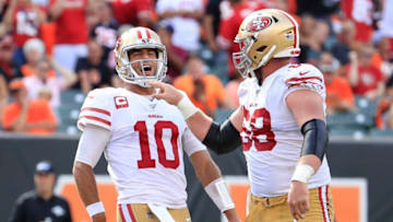 CINCINNATI, OHIO - SEPTEMBER 15: Jimmy Garoppolo #10 of the San Francisco 49ers and Mike Person #68 celebrate after a touchdown during the game against the Cincinnati Bengals at Paul Brown Stadium on September 15, 2019 in Cincinnati, Ohio. (Photo by Andy Lyons/Getty Images)