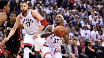 May 5, 2016; Toronto, Ontario, CAN; Toronto Raptors guard Terrence Ross (31) prepares to take a shot against Miami Heat as center Jonas Valanciunas (17) looks on in game two of the second round of the NBA Playoffs at Air Canada Centre. Mandatory Credit: Dan Hamilton-USA TODAY Sports
