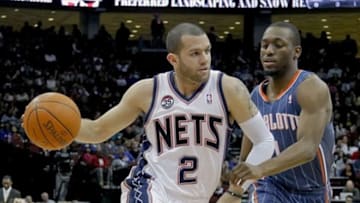 Mar 24, 2012; Newark, NJ, USA; New Jersey Nets point guard Jordan Farmar (2) works against Charlotte Bobcats point guard Kemba Walker (1) during the second half at the Prudential Center. New Jersey Nets defeat the Charlotte Bobcats 102-89. Mandatory Credit: Jim O