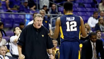 Jan 4, 2016; Fort Worth, TX, USA; West Virginia Mountaineers head coach Bob Huggins yells at guard Tarik Phillip (12) for getting a technical foul during the second half against the TCU Horned Frogs at Ed and Rae Schollmaier Arena. Mandatory Credit: Kevin Jairaj-USA TODAY Sports