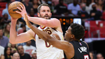 MIAMI, FLORIDA - MARCH 11: Kevin Love #0 of the Cleveland Cavaliers is defended by Kyle Lowry #7 of the Miami Heat during the first half at FTX Arena on March 11, 2022 in Miami, Florida. NOTE TO USER: User expressly acknowledges and agrees that, by downloading and or using this photograph, User is consenting to the terms and conditions of the Getty Images License Agreement. (Photo by Michael Reaves/Getty Images)