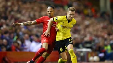 LIVERPOOL, ENGLAND - APRIL 14: Nathaniel Clyne of Liverpool challenges Marco Reus of Borussia Dortmund during the UEFA Europa League quarter final, second leg match between Liverpool and Borussia Dortmund at Anfield on April 14, 2016 in Liverpool, United Kingdom. (Photo by Clive Brunskill/Getty Images)