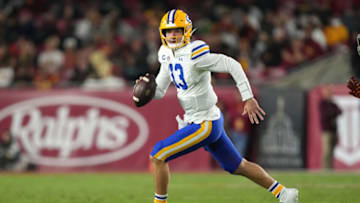 Nov 5, 2022; Los Angeles, California, USA; California Golden Bears quarterback Jack Plummer (13) carries the ball against the Southern California Trojans in the first half at United Airlines Field at Los Angeles Memorial Coliseum. Mandatory Credit: Kirby Lee-USA TODAY Sports