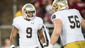 Nov 28, 2015; Stanford, CA, USA; Notre Dame Fighting Irish wide receiver C.J. Sanders (9) celebrates with offensive lineman Quenton Nelson (56) after a kickoff return for a touchdown in the first quarter against the Stanford Cardinal at Stanford Stadium. Mandatory Credit: Matt Cashore-USA TODAY Sports