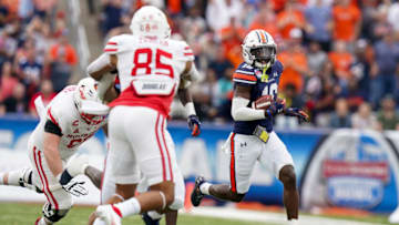 Auburn footballDec 28, 2021; Birmingham, Alabama, USA; Auburn Tigers cornerback Nehemiah Pritchett (18) returns an interception against the Houston Cougars during the second half of the 2021 Birmingham Bowl at Protective Stadium. Mandatory Credit: Marvin Gentry-USA TODAY Sports