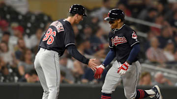 MINNEAPOLIS, MN - MAY 31: Third base coach Mike Sarbaugh #16 of the Cleveland Indians congratulates Francisco Lindor #12 on a solo home run against the Minnesota Twins during the eighth inning of the game on May 31, 2018 at Target Field in Minneapolis, Minnesota. The Indians defeated the Twins 9-8. (Photo by Hannah Foslien/Getty Images)