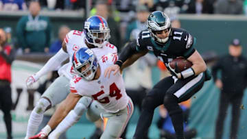 PHILADELPHIA, PA - NOVEMBER 25: Quarterback Carson Wentz #11 of the Philadelphia Eagles against outside linebacker Olivier Vernon #54 of the New York Giants during the second quarter at Lincoln Financial Field on November 25, 2018 in Philadelphia, Pennsylvania. The Philadelphia Eagles won 25-22. (Photo by Elsa/Getty Images)