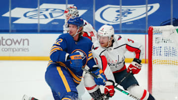 BUFFALO, NY - JANUARY 14: Eric Staal #12 of the Buffalo Sabres and Nick Jensen #3 of the Washington Capitals fight for position during the second period at KeyBank Center on January 14 , 2021 in Buffalo, New York. (Photo by Kevin Hoffman/Getty Images)