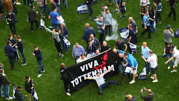 LONDON, ENGLAND - MAY 14: The Tottenham Hotspur fans invade the pitch after the Premier League match between Tottenham Hotspur and Manchester United at White Hart Lane on May 14, 2017 in London, England. Tottenham Hotspur are playing their last ever home match at White Hart Lane after their 112 year stay at the stadium. Spurs will play at Wembley Stadium next season with a move to a newly built stadium for the 2018-19 campaign. (Photo by Clive Rose/Getty Images)
