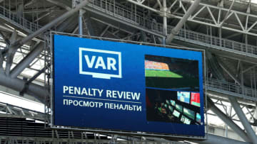 KAZAN, RUSSIA - JUNE 16: The LED screen shows VAR reviewing a penalty decision during the 2018 FIFA World Cup Russia group C match between France and Australia at Kazan Arena on June 16, 2018 in Kazan, Russia. (Photo by Catherine Ivill/Getty Images)