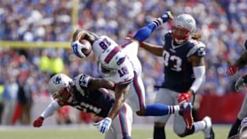 Sep 20, 2015; Orchard Park, NY, USA; Buffalo Bills wide receiver Percy Harvin (18) is tackled by New England Patriots cornerback Malcolm Butler (21) during the first half at Ralph Wilson Stadium. Mandatory Credit: Kevin Hoffman-USA TODAY Sports