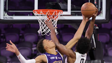 Victor Wembanyama #1 of Boulogne-Levallois Metropolitans 92 blocks a shot by Scoot Henderson (Photo by Ethan Miller/Getty Images)
